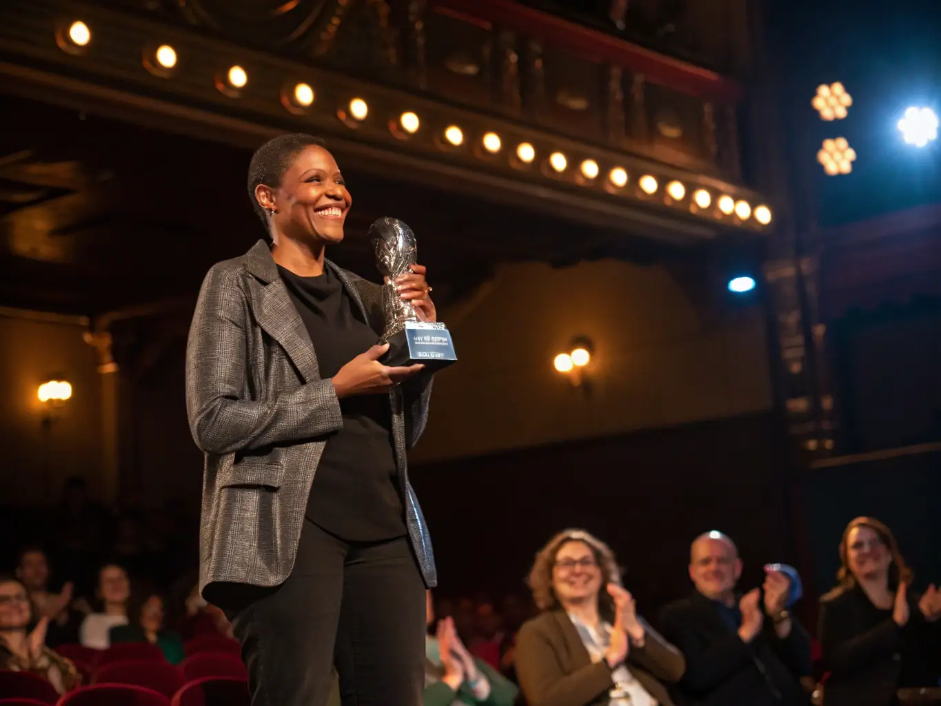 An image of a successful Canadian entrepreneur receiving an award, symbolizing achievement and recognition in the Canadian startup ecosystem.